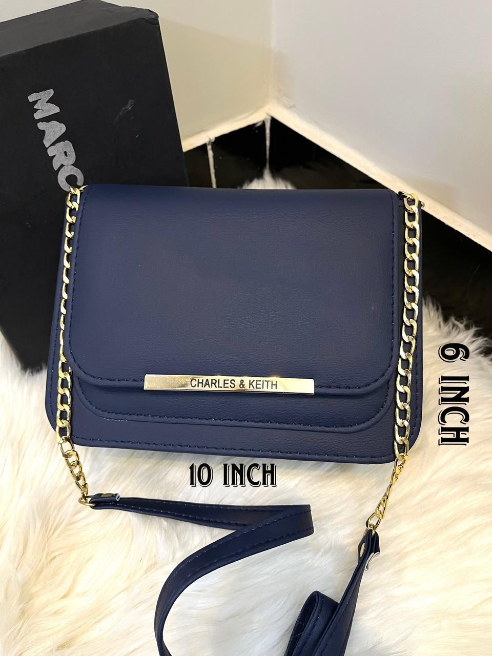 Navy blue Charles & Keith crossbody bag with gold chain strap