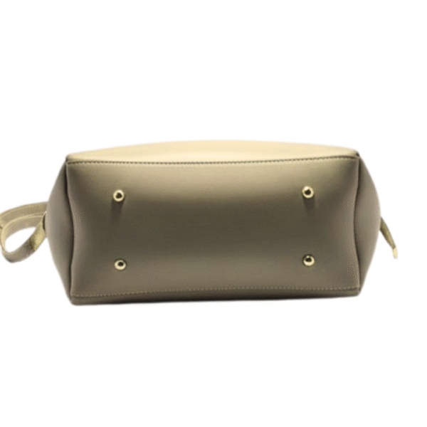 Bottom view of beige tote handbag with studs