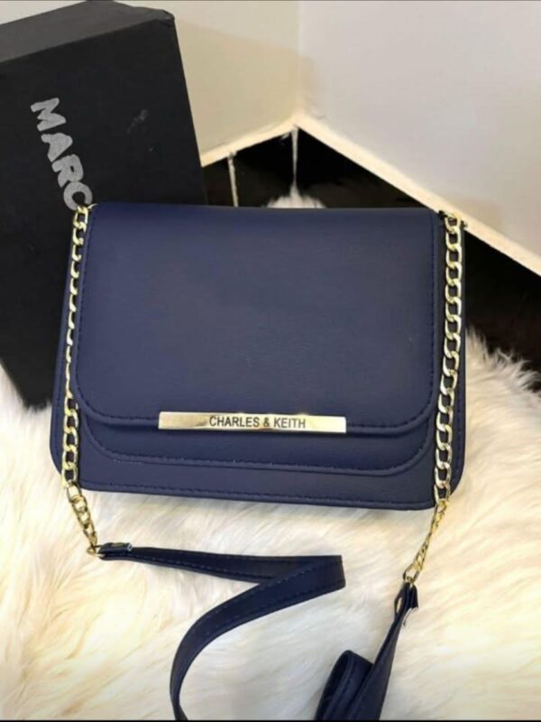 Navy blue Charles & Keith crossbody bag with gold chain strap