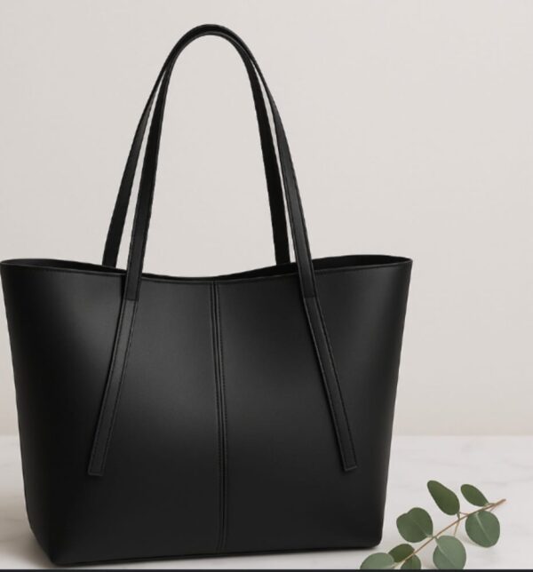sleek black structured tote bag for women with double shoulder straps and minimalist stitching