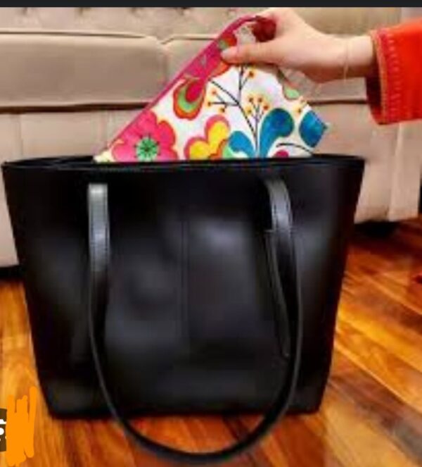 sleek black structured tote bag for women with double shoulder straps and minimalist stitching