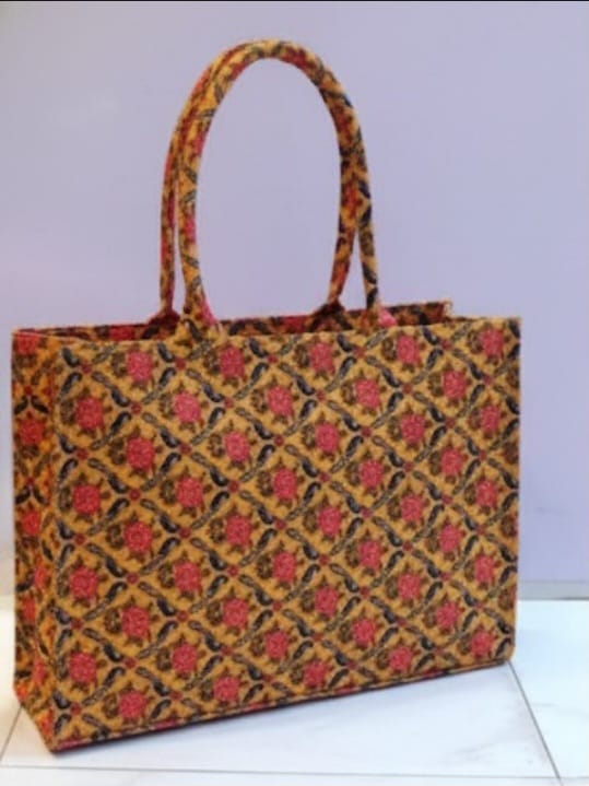 Woman carrying stylish ethnic tote bag – perfect for work, shopping, or casual outings