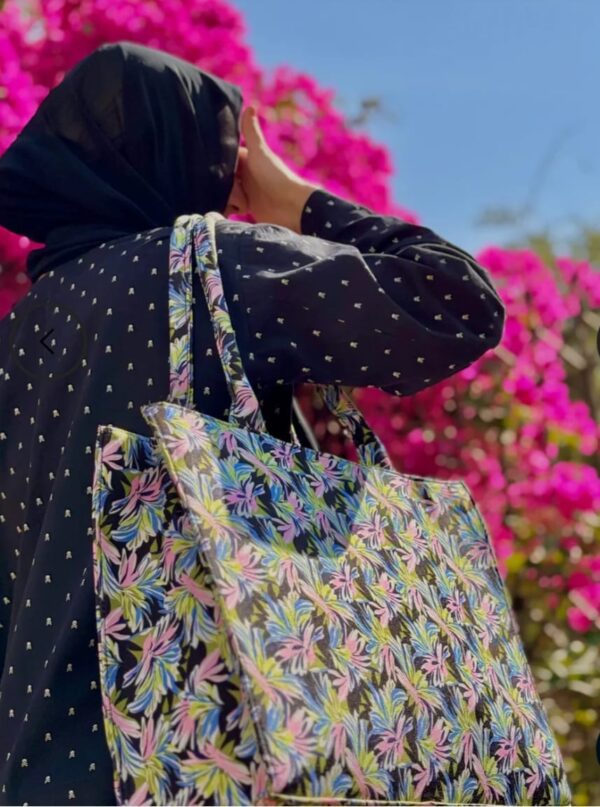 Women's floral structured tote bag with pink, green, and blue leaf pattern