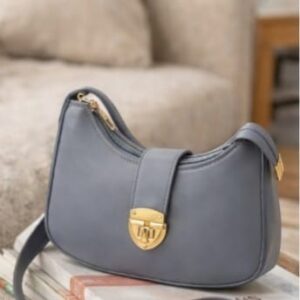 Stylish curved shoulder bag with gold hardware