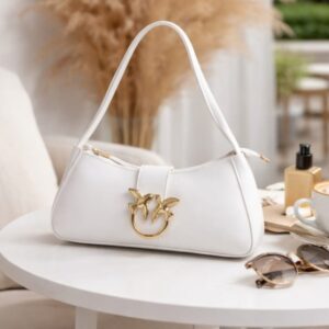 Zwore white handbag close-up showing bird buckle detail